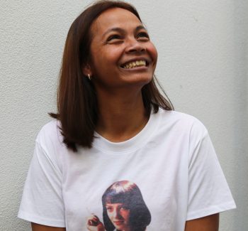 Woman smiling in a white t-shirt
